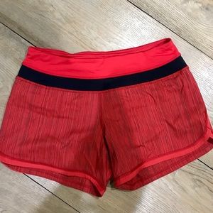 Red Lululemon running shorts